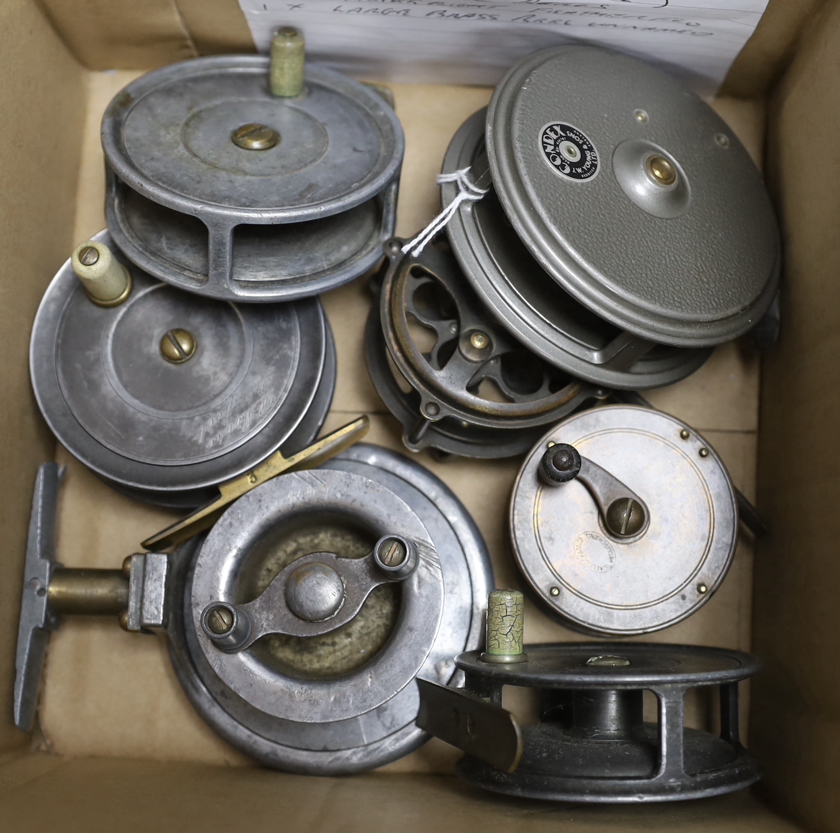 Twelve various fishing reels including a brass and horn handled 4 inch reel and a pair of Hardy wader hangers